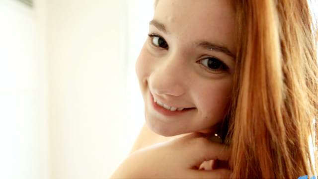 Cute redhead babe Ava Sparxxx is posing like a teen