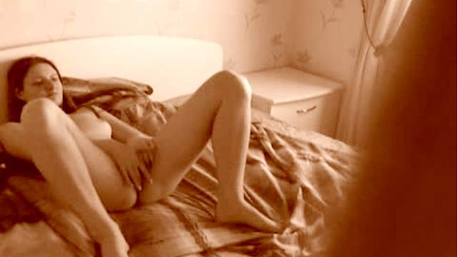 Horny teen in bedroom plays with pussy
