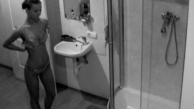 Leggy teen showers on hidden cam
