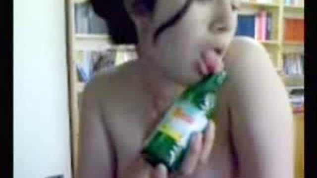 Babe bangs pussy with a bottle